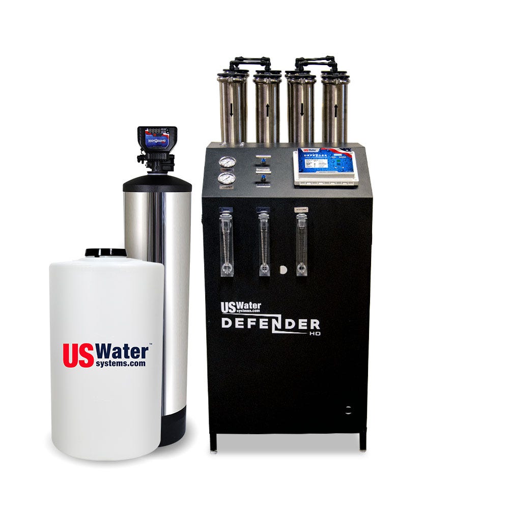 The Defender Commercial RO System by US Water Systems Inc, featuring a cylindrical tank and black control unit with gauges and tubes, offers an eco-friendly water filtration solution. Perfect for those seeking efficient clean water, this system processes 2000 - 16000 GPD.