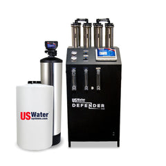 The Defender Commercial RO System by US Water Systems Inc, featuring a cylindrical tank and black control unit with gauges and tubes, offers an eco-friendly water filtration solution. Perfect for those seeking efficient clean water, this system processes 2000 - 16000 GPD.