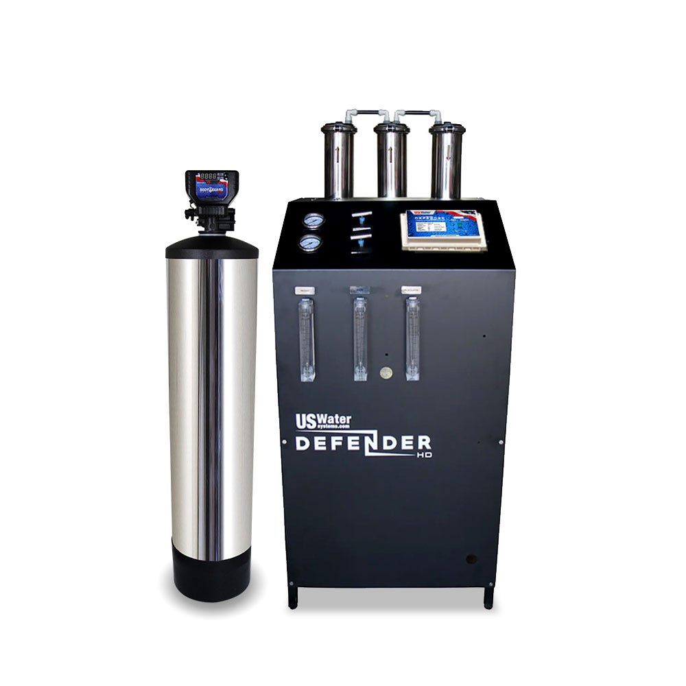 The Defender Commercial RO System by US Water Systems Inc features a large silver tank and black control unit labeled Defender HD, with gauges, tubes, and a digital display. It combines eco-friendliness with advanced technology for superior performance.