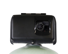 Close-up of a black control valve head atop the US Water Backwashing Catalytic Carbon Filter 1.5 Inch (10-30 GPM) by US Water Systems Inc, featuring dial and adjustment settings for effective RO pre-treatment.