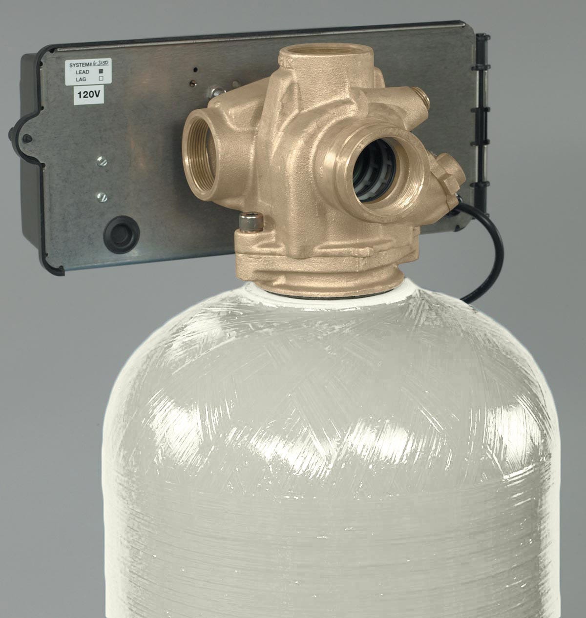 A close-up view of the Fleck 3150 2 Backwashing Catalytic Carbon Filter by US Water Systems Inc, featuring a control valve on a translucent fiberglass tank, expertly designed for iron and sulfur removal.