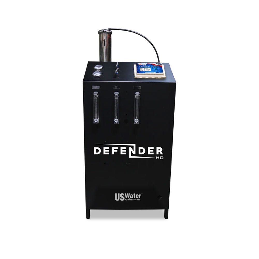 The eco-friendly Defender Commercial RO System by US Water Systems Inc, available in 2000 - 16000 GPD capacities, features three flow meters, a pressure gauge, and a display screen on top for efficient performance.