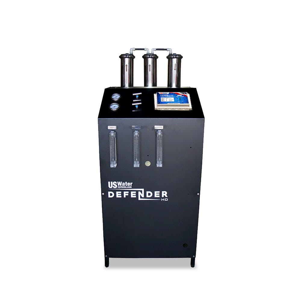 The black Defender Commercial RO System by US Water Systems Inc features an eco-friendly design with three vertical filters and top control gauges, making it a sustainable choice for those seeking a commercial RO system (2000 - 16000 GPD).