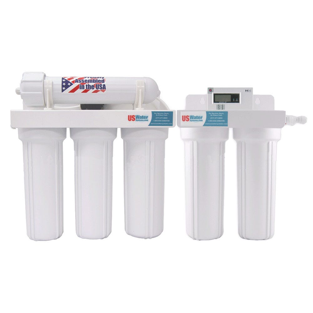 The US Water Systems Inc Reverse Osmosis Deionization Water Purification System | RO-DI-100 features labeled white cylindrical filter housings, a digital display, an "Assembled in the USA" sticker, and delivers clean water at 100 GPD.