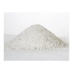 A small mound of Premium Fine Calcite pH Water Neutralizer Media from US Water Systems Inc, resembling white sand on a flat surface, set against a plain white background.