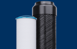 Two water filter cartridges, one white with a blue rim and one black, with the text PFOA/PFOS Treatment and a Shop Now button above them on a blue background.