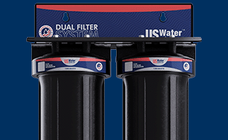 Two black water filter canisters with labels displayed under the text Whole House Filtration and a Shop Now button on a blue background.