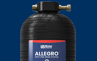 A black US Water Allegro spot-free rinse system tank with brass fittings is displayed below the text Spot-Free Rinse Systems and a Shop Now button on a blue background.