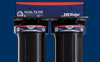 Two black water filter canisters with labels displayed under the text Whole House Filtration and a Shop Now button on a blue background.